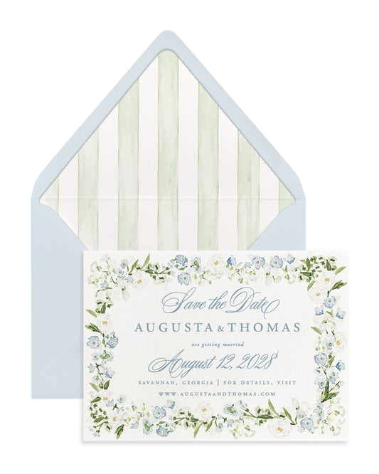 Luxury blue floral save the dates featuring hand-painted watercolor flowers, premium cardstock, and coordinating envelope liners for elegant weddings.