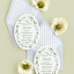 Luxury oval save the date with a hand-painted blue floral watercolor border, elegant green typography, and a powder blue envelope with coordinating watercolor striped liner for garden and coastal weddings