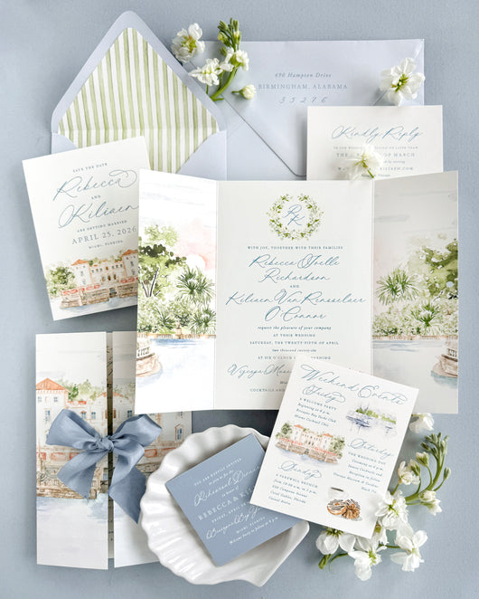 Luxury Vizcaya Museum and Gardens wedding invitation suite featuring watercolor venue artwork, gatefold invitations, custom weekend itinerary cards, blue silk ribbon, and elegant fine art wedding stationery inspired by Miami destination weddings.